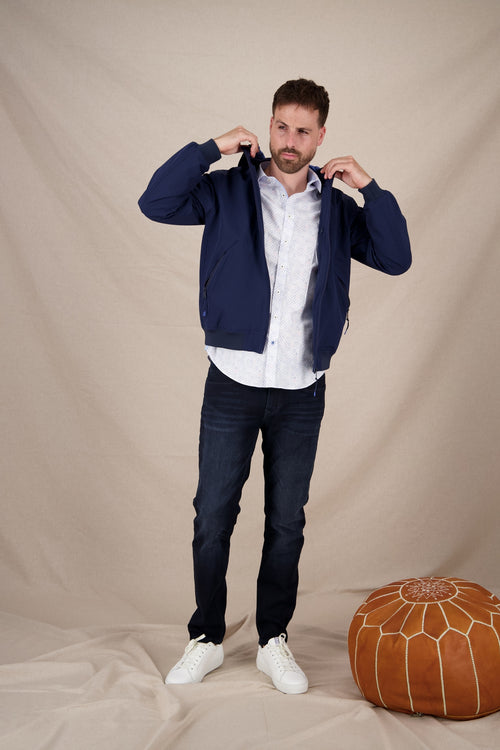 A fish named Fred - Sportive jacket - Men's navy sportive jacket from A Fish Named Fred featuring a front zipper and subtle fish hook detail, paired with white.