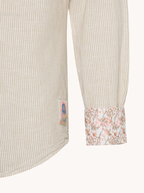 A fish named Fred - Shirt stripe linen - Beige striped linen shirt sleeve with floral print cuff and small A Fish Named Fred logo patch near hem.