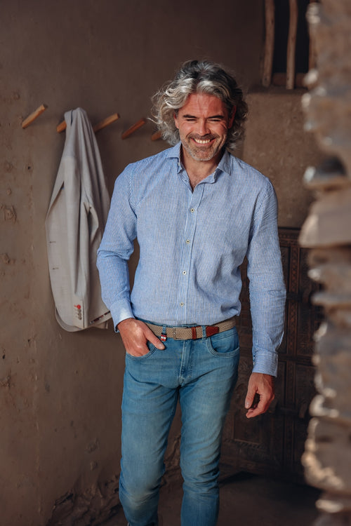 A fish named Fred - Shirt stripe linen - Light blue linen shirt with subtle stripe texture from A Fish Named Fred, styled with casual jeans, showcasing premium mens.