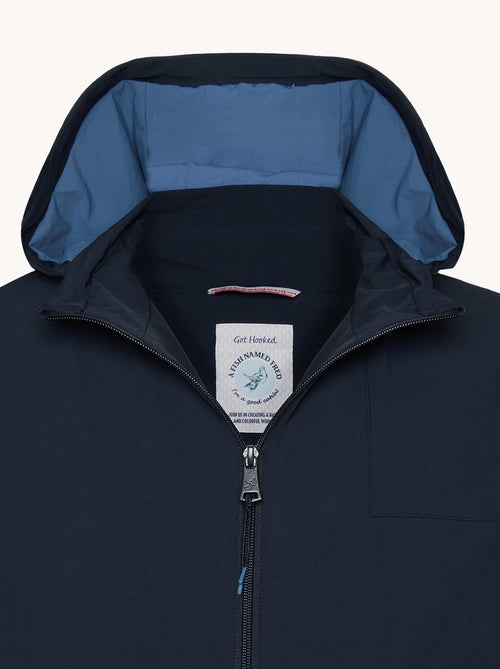 A fish named Fred - Sportive jacket - Navy sportive jacket with zip closure, blue lined hood, and A Fish Named Fred label featuring fish hook detail.