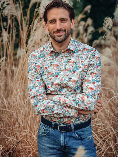 A Fish Named Fred men's Fuji Dream shirt in Off-White, worn by a model in tall pampas grass