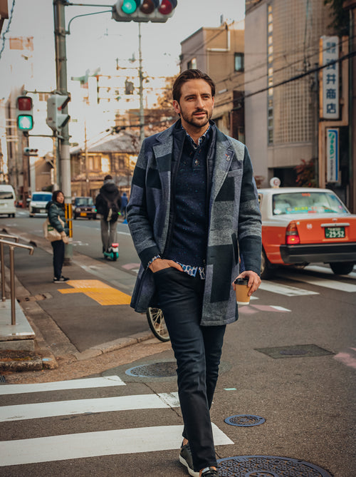 A Fish Named Fred men's Big Check overcoat in Navy, worn by a model crossing a city street
