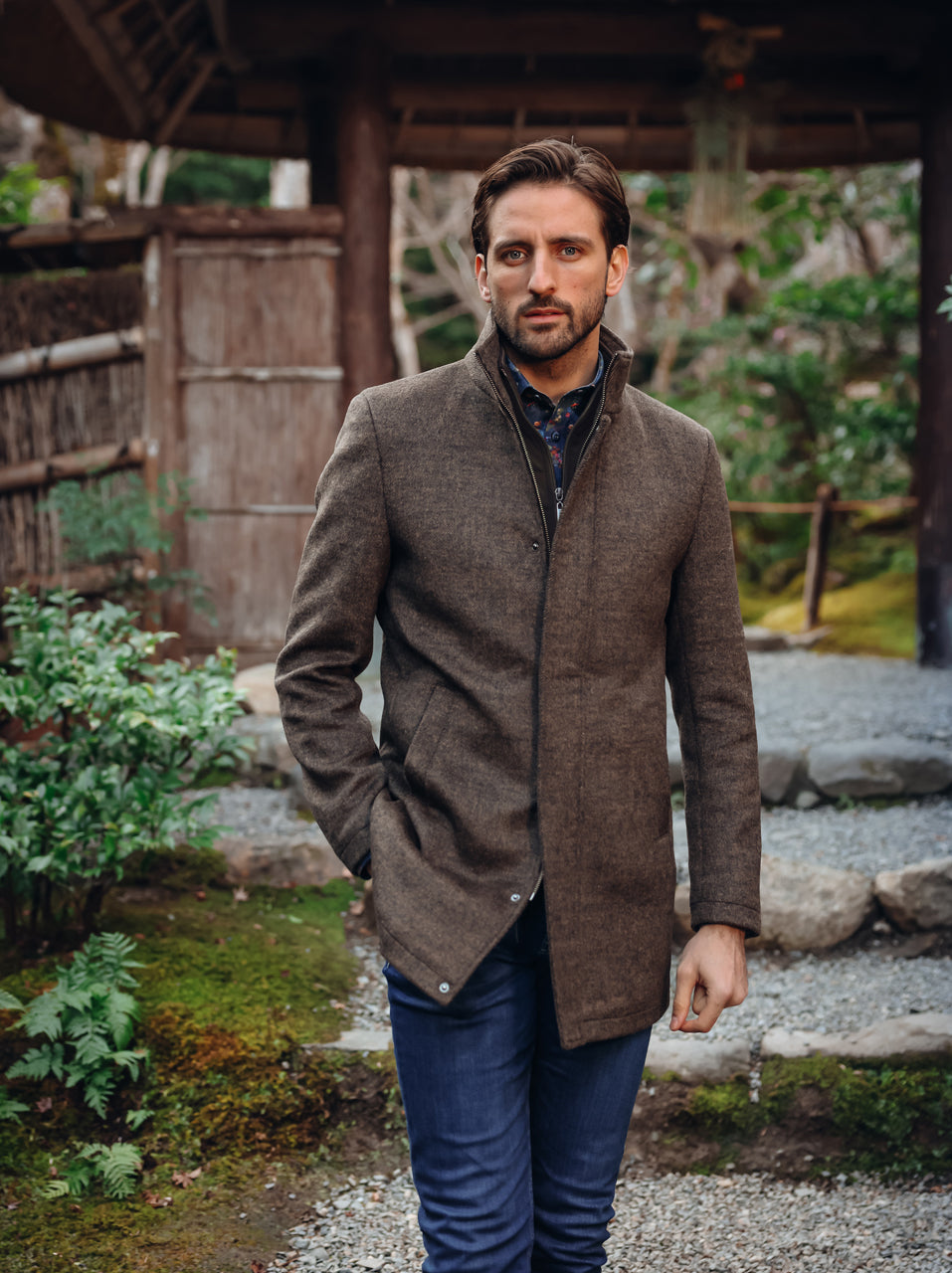 A Fish Named Fred men's Funnel Neck Coat in Chocolate Brown, worn by a model, outdoor lifestyle shot