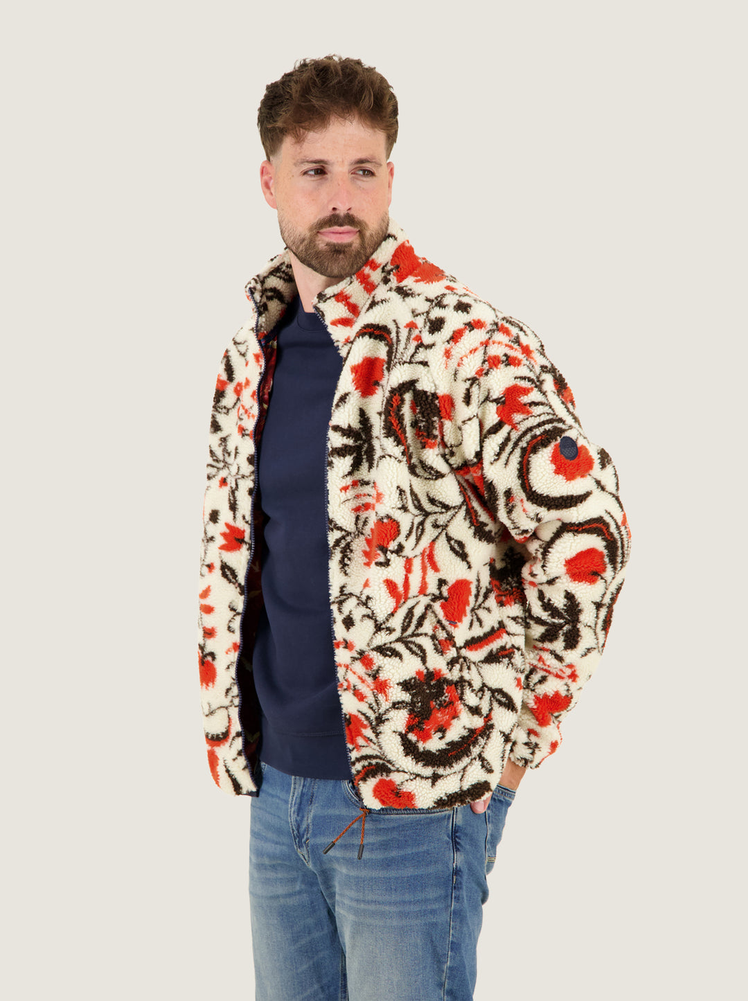 A Fish Named Fred men's Fleece Jacket Blossom in Off-White, worn by a model, three-quarter view