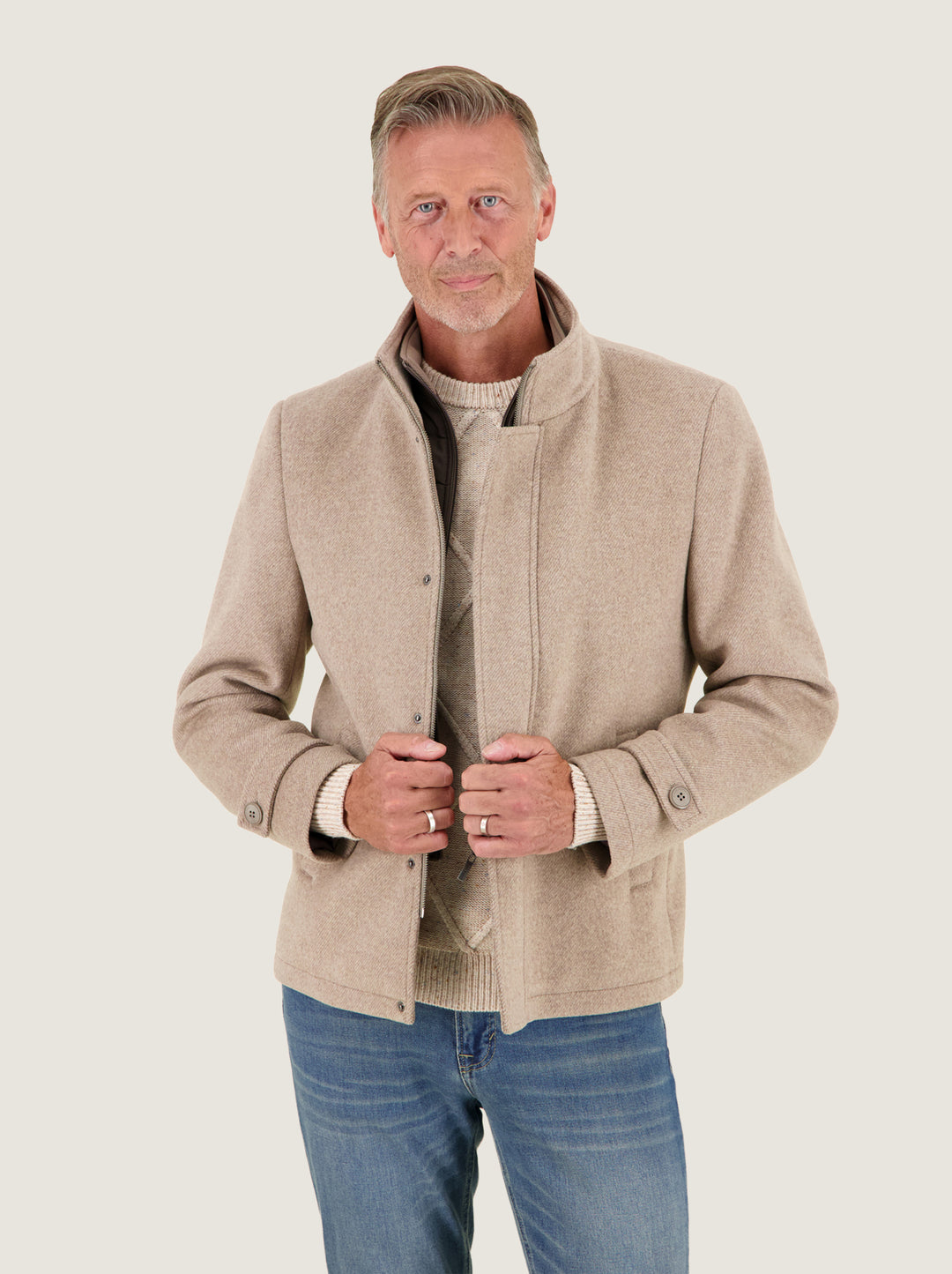 A Fish Named Fred men's Short Funnel Neck Coat in Sand, worn by a model, studio shot